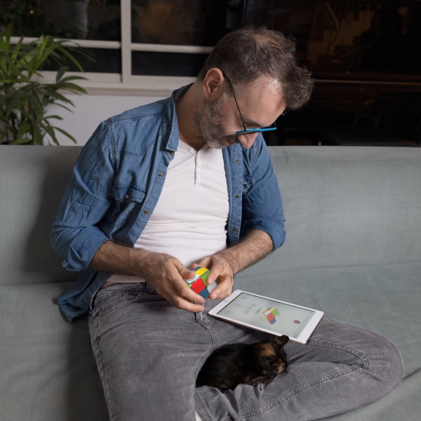 a man playing in Rubik's Cube Game