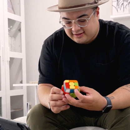 man playing with Smart Rubik's Cube